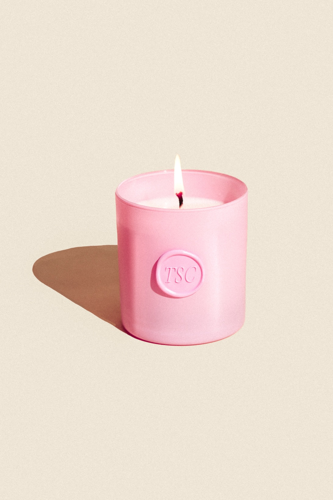 pink candle with flame in pink holder embossed TSC