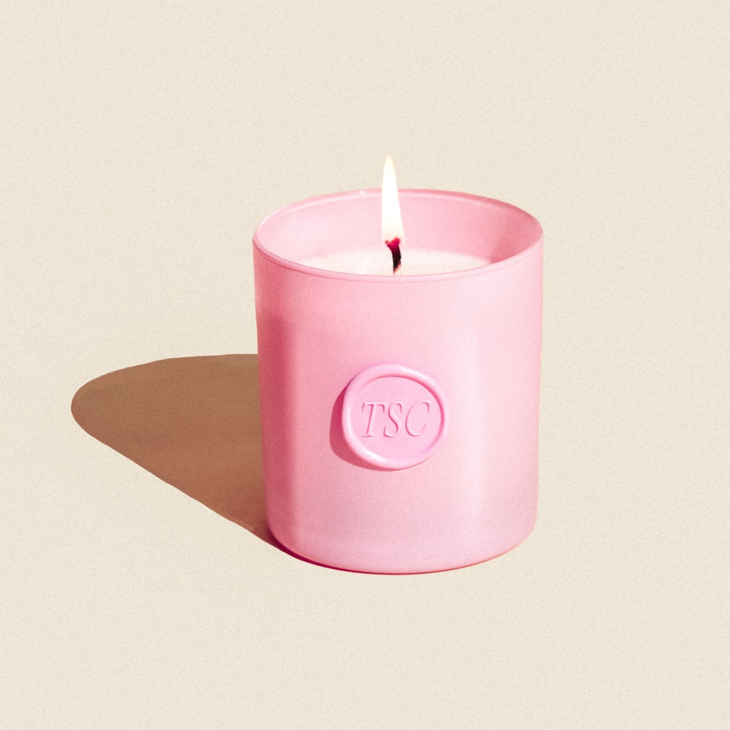 pink candle with flame in pink holder embossed TSC