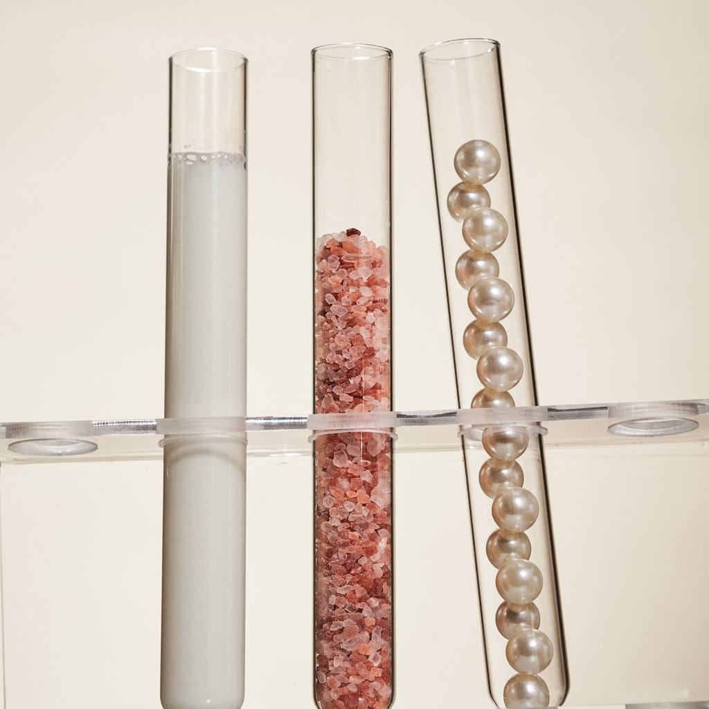 test tubes with liquid salt and pearls